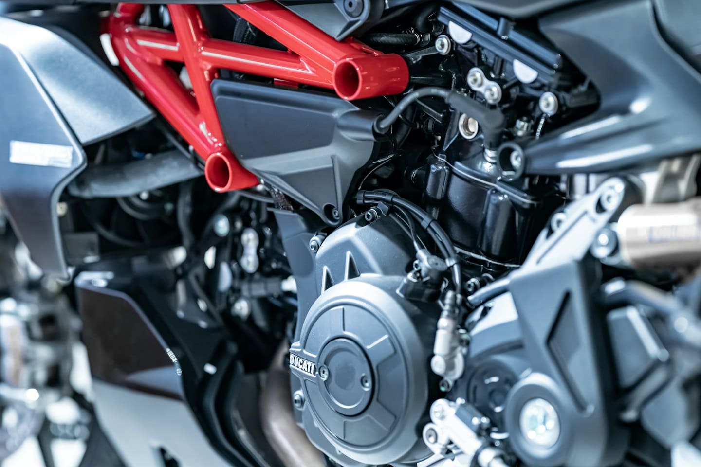 Detailed mechanical components inside a motorcycle engine with red framing.